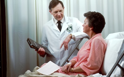 Doctor consulting happy family - Health insurance benefits