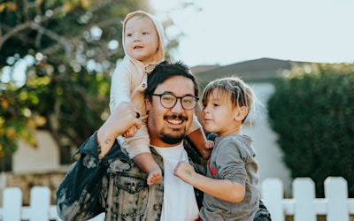 Happy family in park - Life insurance security
